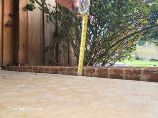 Due to soil erosion, this front porch slab dropped 2", creating a big trip hazard.