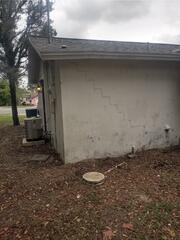 The appearance of stair-step pattern cracks in the exterior walls of the home indicated a clear sign that the foundation was settling.
