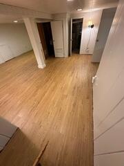 With our Light Pecan ThermalDry Elite Plank Flooring, these homeowners can enjoy a finished look and feel with our patented, insulated floors.