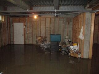 This basement had a lot of water coming in, leaving puddles.