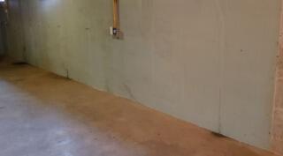Leaking wall cracks before being repaired.