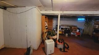 This basement had water seepage that was causing water damage throughout the space. They needed a permanent solution.