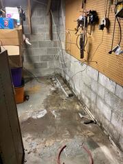 When our Service Manager, Chuck, first got to Terry's home, he could see the dampness from where the water leaked into Terry's basement. He knew that there was standing water on the opposite side of the wall.
