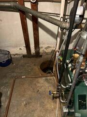 This basement had an old sump pump that was not working to keep their basement dry, as moisture was clearly still present.