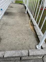 The porch on the side of the home had gradually settled over the course of a few years, eventually reaching a point where it was too dangerous to use.