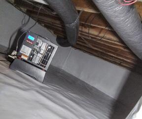 Our SaniDry Sedona dehumidifier (see left of photo) is installed in this crawlspace to prevent the buildup of moisture and filter the air to prevent mold buildup. Absorbing up to 95 pints of water a day, the SaniDry expels water automatically for limited maintenance and easy operation.