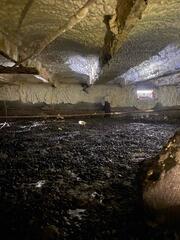 Look at this damp crawl space! This homeowner wanted their dirt and gravel crawl space to be completely encapsulated from the ground.