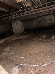 Prior to installation of any products, this crawlspace featured a dirt floor with piers holding up the house.