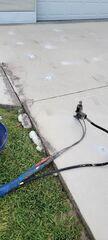 An expanding foam material called PolyLevel is injected through small drill holes created throughout the surface of the concrete slab. Once injected, the material starts to expand to work its magic, filling voids and creating desired lift.