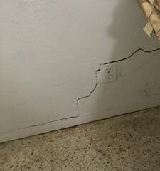 The homeowner became increasingly alarmed as they noticed the cracks along the interior walls of their home growing larger.