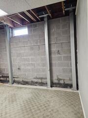 Our crew installed several powerbraces along this wall to stabilize it and prevent it from bowing further.