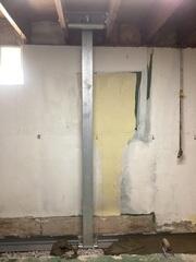 Our crew install several powerbraces to combat Craig's bowed wall.