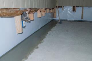 This WaterGuard French drain system helps collect water along the perimeter walls.