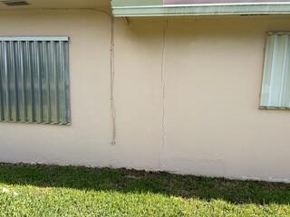 The homeowner knew that his home's addition had experienced settlement damage when vertical cracks appeared on the exterior walls.