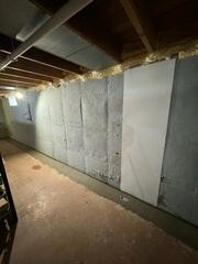Our team installed new drainage and repaired several foundation cracks for this homeowner.