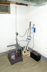 Featured in this picture:
TripleSafe Sump Pump (Corner of wall): Three levels of protection against basement moisture, including a battery backup (black battery attached to right of TripleSafe cover).
DryTrak Perimeter Drain: Installed along perimeter, collects water along wall.
BrightWall: Installed on walls, enhances appearance of space while acting as a vapor barrier.
Elite Plank Flooring: Installed on floor, creates a thermal barrier with the ability to increase floor temperature up to 10 degrees.
SaniDry Sedona: Featured to the left of the TripleSafe system, this dehumidifier...
