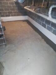 Installed is our WaterGuard French drain system (see fresh concrete along perimeter), and CleanSpace vapor barrier (white vapor barrier along walls). These two systems work together to mitigate unwanted basement moisture!