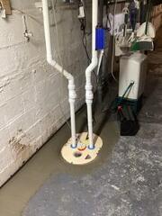 Our crew installed our highly effective TripleSafe sump pump system to combat the water seepage in this basement.