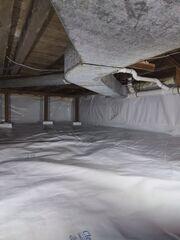 Our CleanSpace vapor barrier is installed along the floor and walls of this crawlspace, protecting against unwanted moisture!