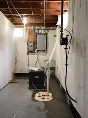 Our crew came in and installed a full perimeter drainage system leading to our patented SuperSump Plus system. Additionally, we installed a SaniDry Sedona dehumidifier!