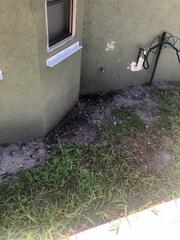 Flooding rainwater had compromised the foundation, leading to water intrusion inside the home.