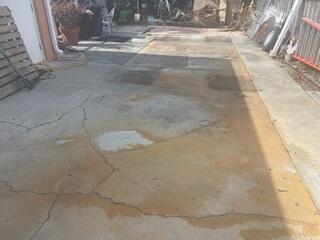 The homeowner's concrete driveway was in need of repairs after years of wear and tear and soil settlement had taken it's toll.