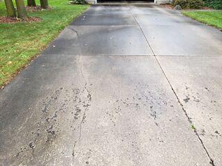 As seen in the before photo, the concrete was experiencing significant cracking, creating potential hazards and diminishing the home's curb appeal.