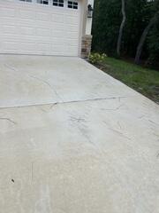 Numerous cracks had gradually appeared over time throughout the concrete driveway, causing concern for the homeowner.