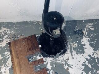 This basement was still dealing with water issues because this sump pump was not working properly. A full perimeter system and proper sump pump were needed.