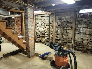 This basement had a lot of old support posts, so they needed a permanent solution.