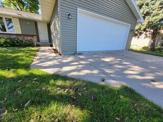 Before our team stepped in, the homeowner in Menasha, WI faced unsightly and potentially dangerous cracked concrete, as evident in the before photo.