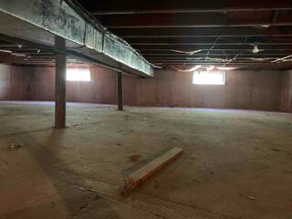 This basement needed multiple new crawlspace support posts in order to stabilize and support the home above.