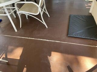 The homeowner's patio concrete had gradually sunk and become uneven over time, creating a tripping hazard.