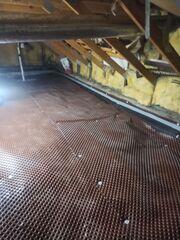 Our dimpled drainage matting goes down before the vapor barrier and is designed to collect water from the crawl space floor and direct is to a sump pump so that water isn't standing along the floor.
