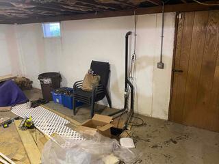 This basement has ongoing water seepage and needed a full perimeter waterproofing system.