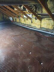 Our CleanSpace Drainage Matting is installed along the floor before we out down the vapor barrier. The dimpled design keeps directs any water under the vapor barrier to the sump pump to avoid standing water along the foundation of the home.