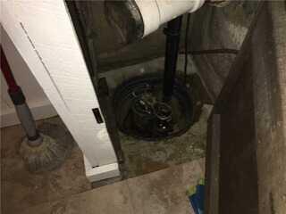This basement had an old sump pump that was doing nothing to eliminate water. So our system was proposed to replace it.