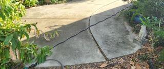 The homeowner's concrete patio had gradually settled over time due to the erosion of the underlying soil.