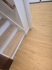 The light pecan color matches their stairs and other finished parts of the basement very well.