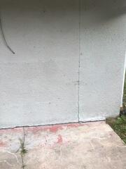 Vertical wall cracks along the home's exterior walls were a clean indication that the foundation's stability had been compromised.