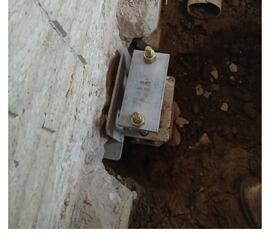 Installers drill the push pier until it reaches stable soil in order to relieve the pressure from the wall.