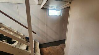 When the inhabitants of this home go to their basement to do laundry, their experience will be a lot more comfortable.