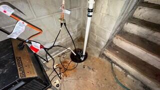 This basement had water seepage issues during heavy rains and with an old sump pump system that was inactive, they needed a new, permanent solution.