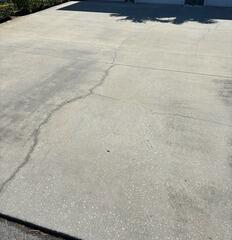 Large cracks had spread across the surface of the homeowner's concrete driveway, reducing its curb appeal and posing potential tripping hazards.