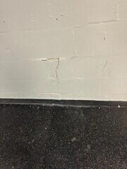 Large cracks along the building's exterior walls were a clear indication that the foundation's stability had been compromised.