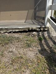 Heavy rainfall and pooling around the homeowner's pool deck had caused the underlying soil to erode and wash away.