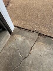 Before: Cracked Concrete Slab at Garage Threshold