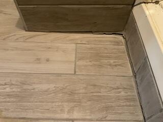 Sagging Tile Floor Indicates Foundation Shift