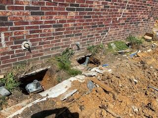 Helical Pier Installation for Settling Brick Foundation