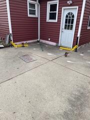 This in-progress photo shows our crew injecting PolyLevel® beneath the sunken concrete. The expanding foam gently lifts and levels the slab with precision, minimizing disruption and downtime.